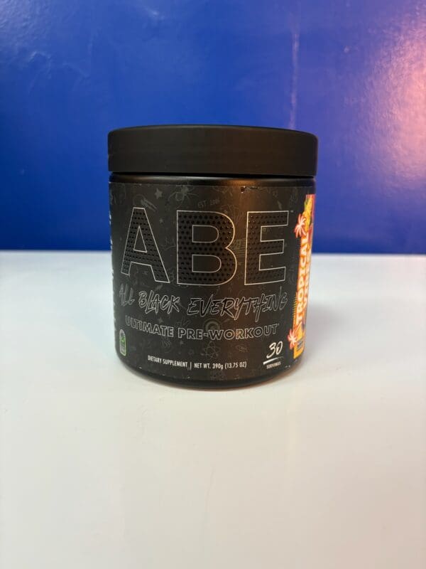 A container of abe raw chocolate is sitting on the counter.