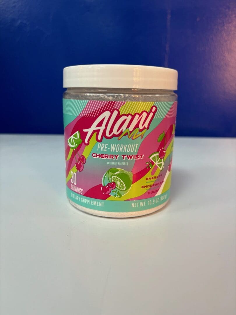 A jar of alani is sitting on the table.