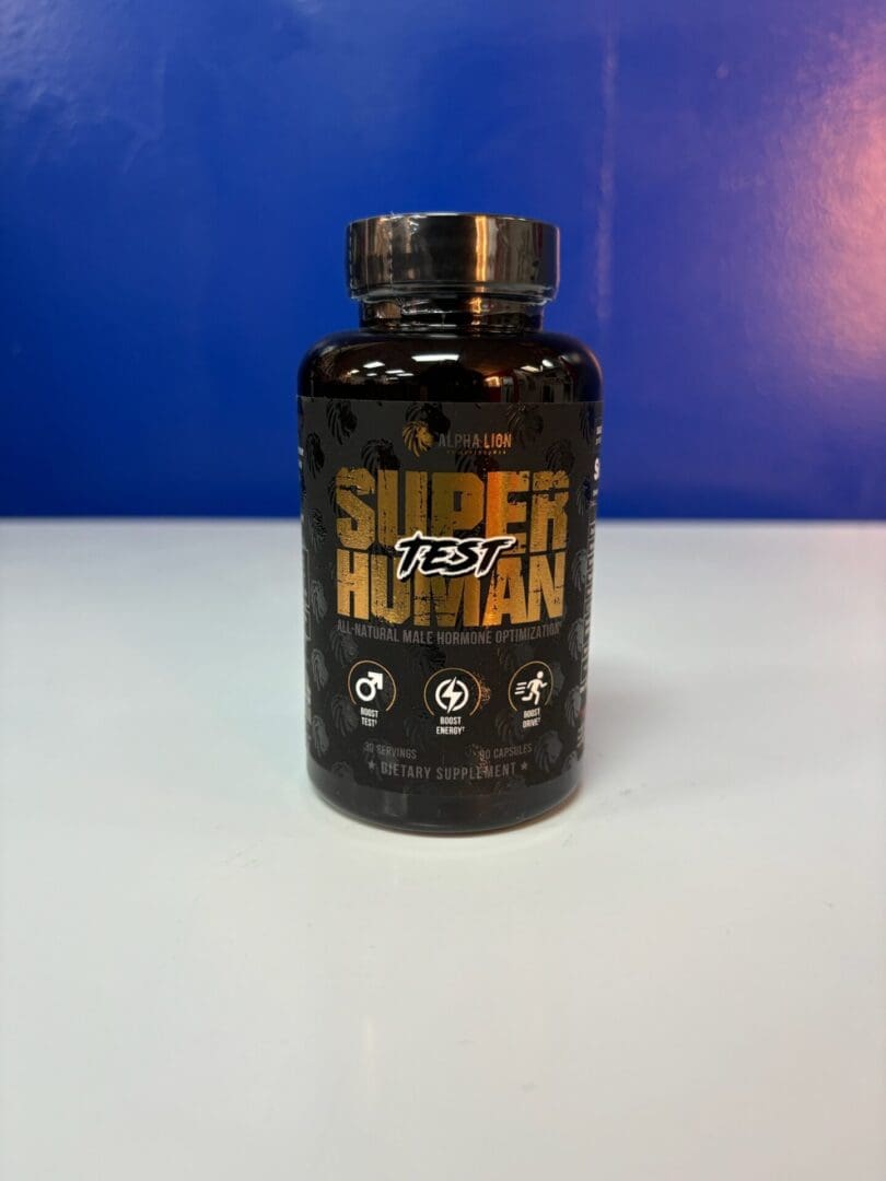 A bottle of super human supplement on top of a table.