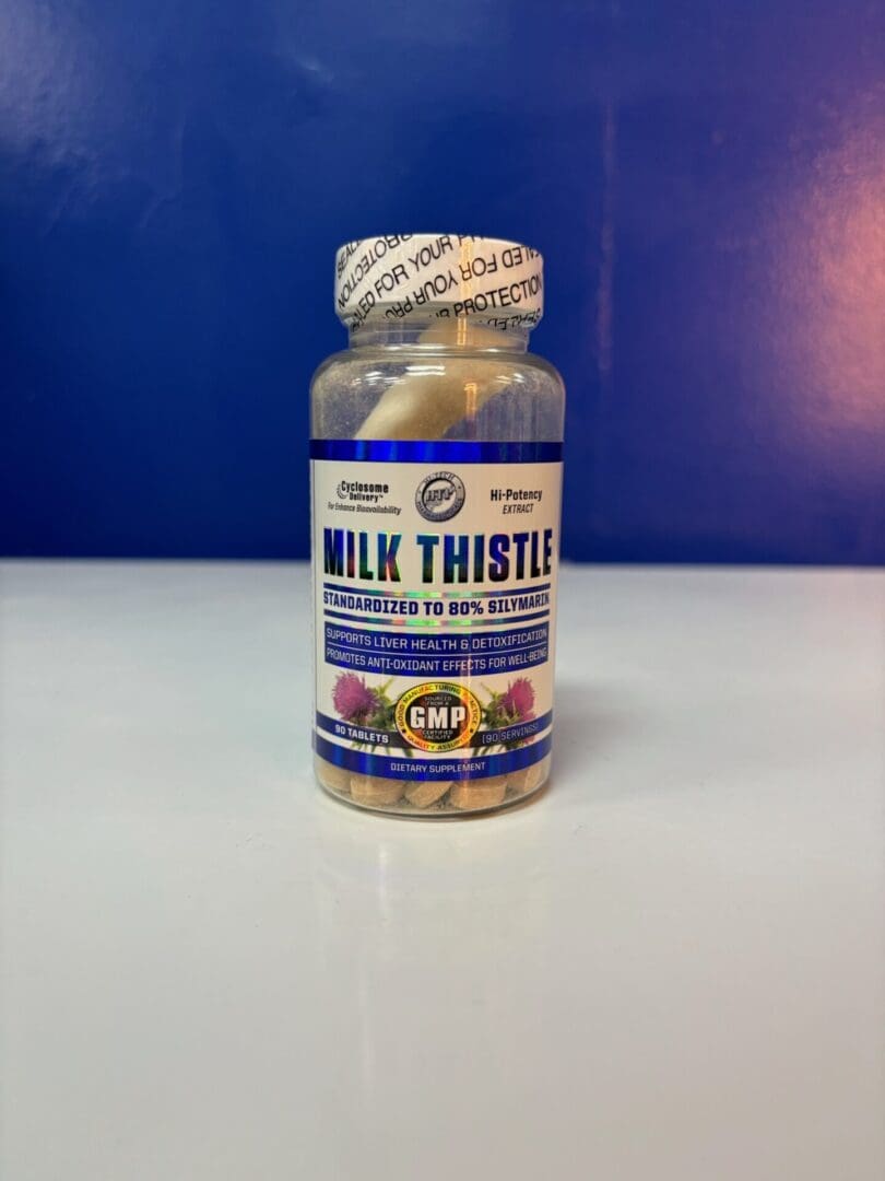 A bottle of milk thistle pills sitting on top of a table.