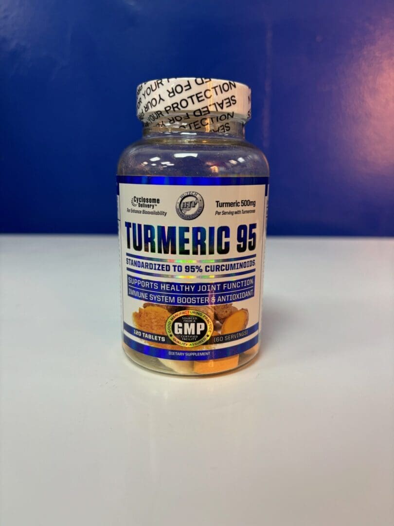 A bottle of turmeric is sitting on the counter.