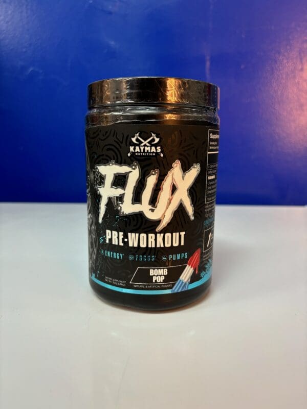 A jar of flux pre-workout is sitting on the counter.