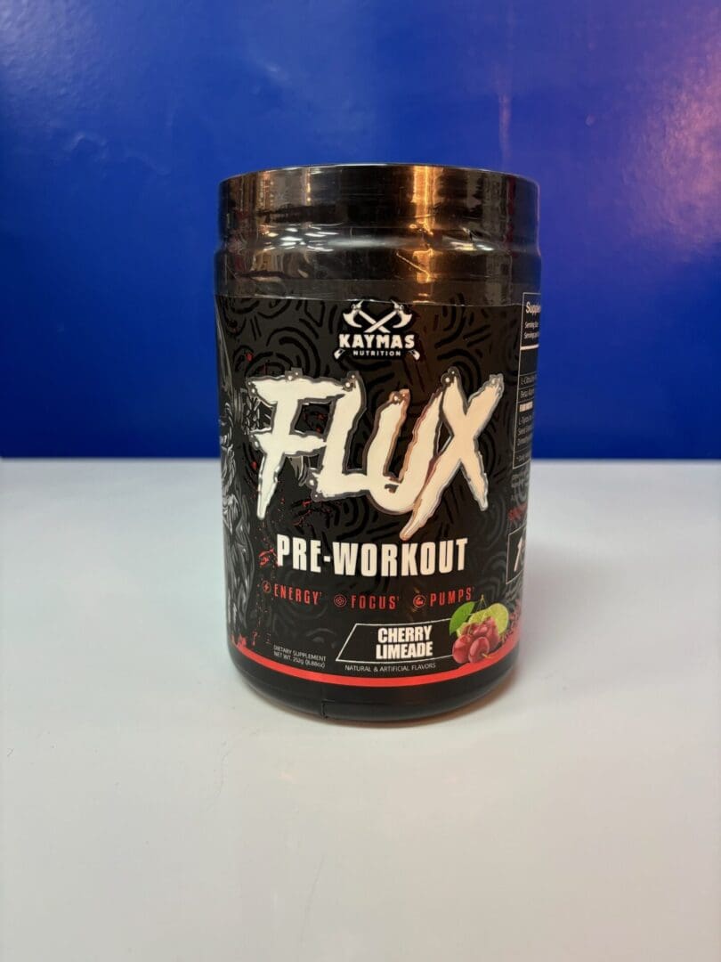 A jar of flux pre-workout is sitting on the counter.