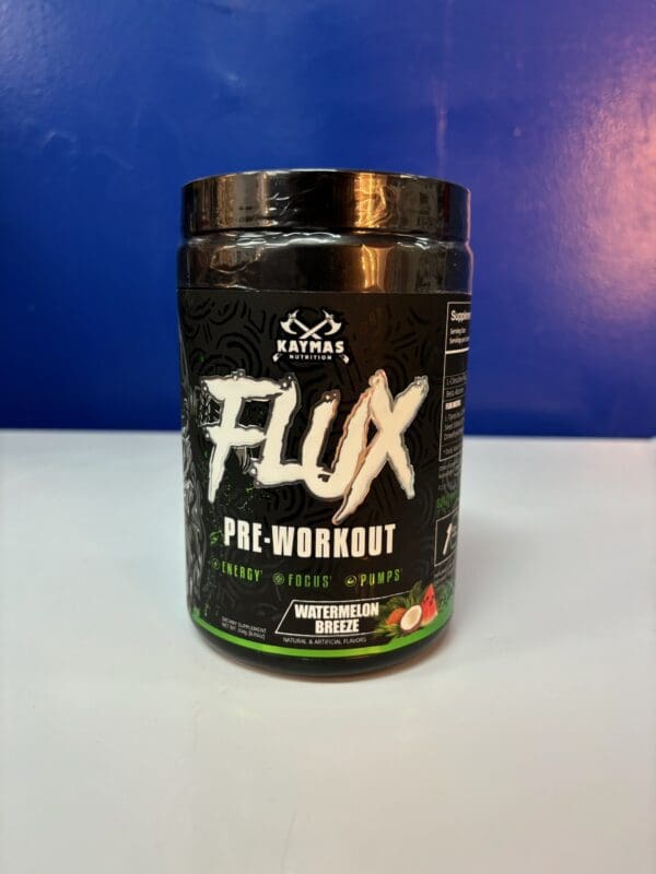 A jar of flux pre-workout is sitting on the counter.