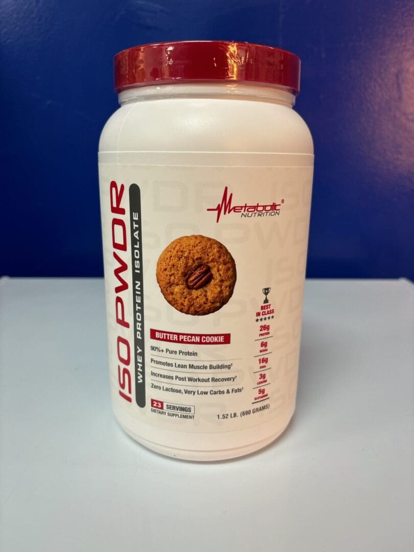 A container of protein powder with cookies on top