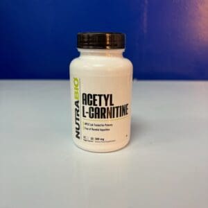 A bottle of acetyl l-carnitine on top of a table.