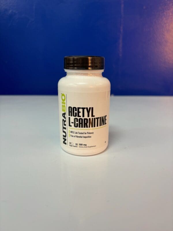 A bottle of acetyl l-carnitine on top of a table.