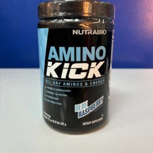 A container of amino kick is sitting on the counter.