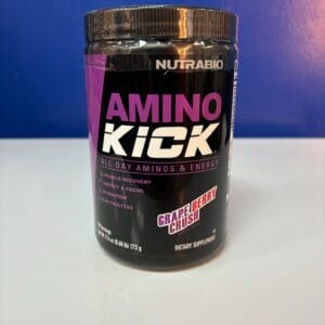 A container of amino kick is sitting on the counter.