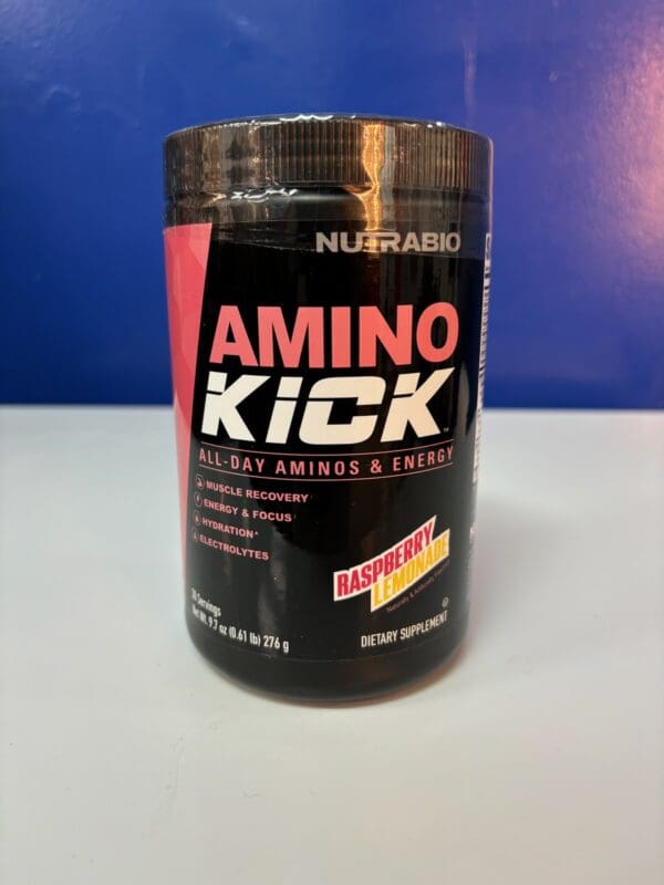 A container of amino kick is shown on the table.