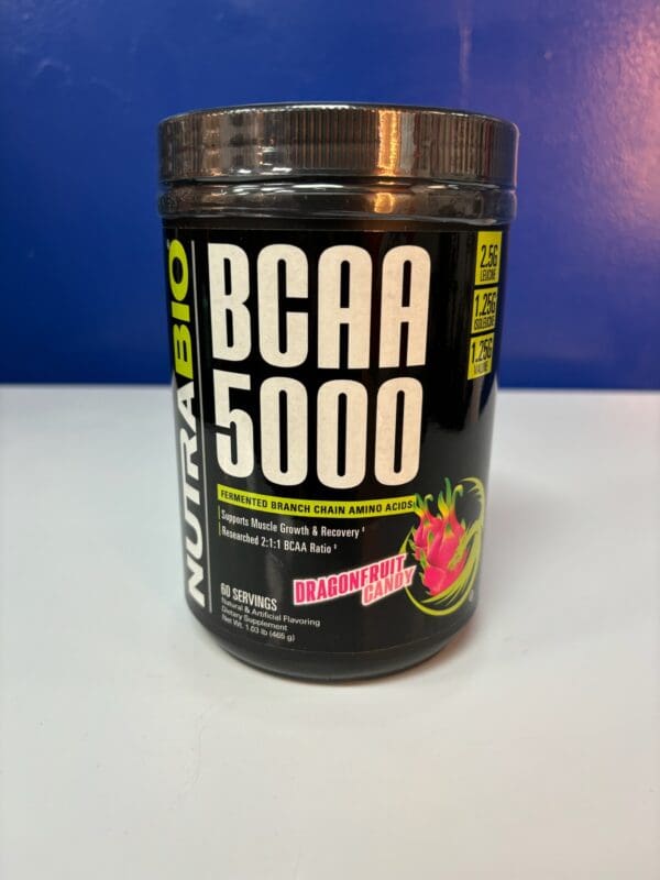 A jar of nutrabio bcaa 5 0 0 0 next to some fruit.