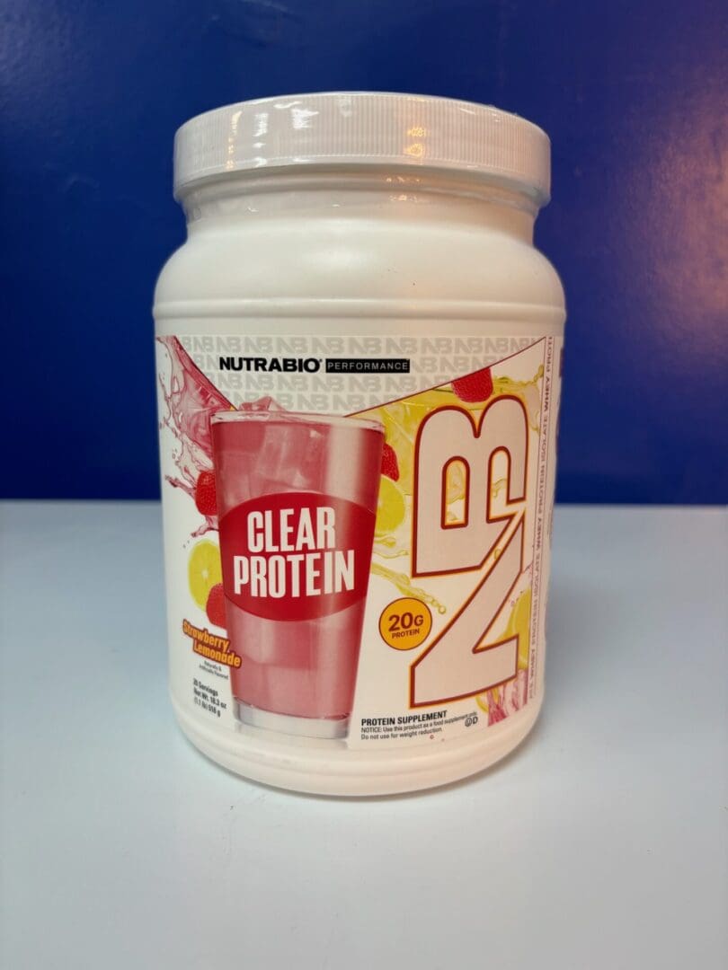 A container of protein powder on a table.