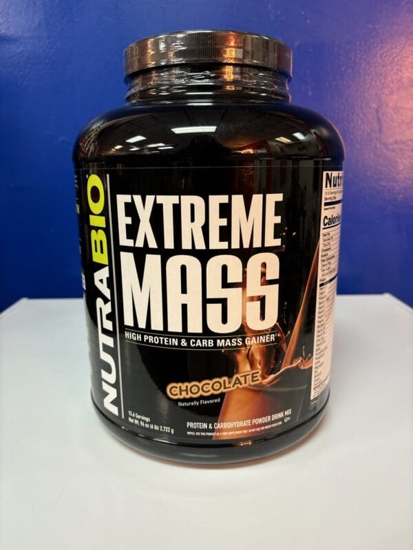 A bottle of nutrabio extreme mass is sitting on the counter.