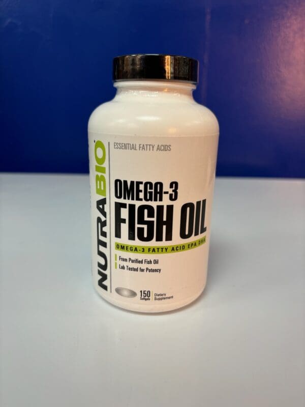 A bottle of fish oil on top of a table.