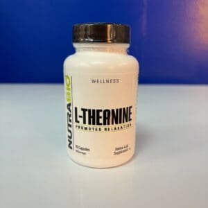 A bottle of l-theanine is sitting on the table.