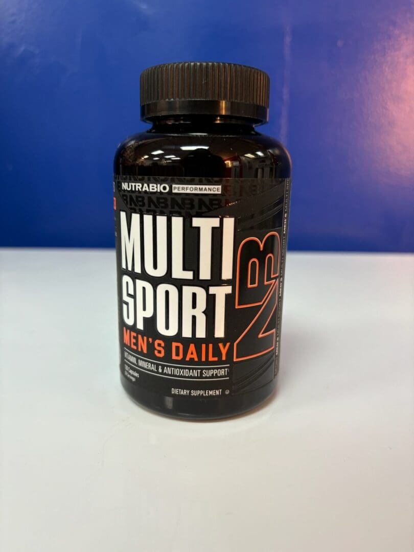 A bottle of multi sport supplement on top of a table.