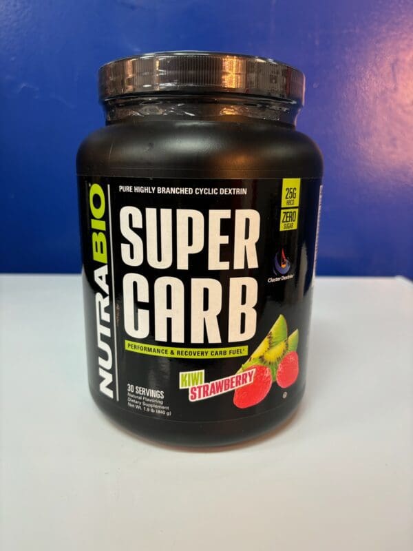 A container of nutrabio super carb is sitting on the counter.