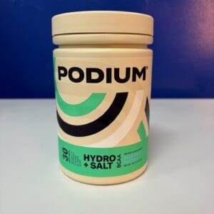 A container of hydrolyzed whey protein on top of a table.