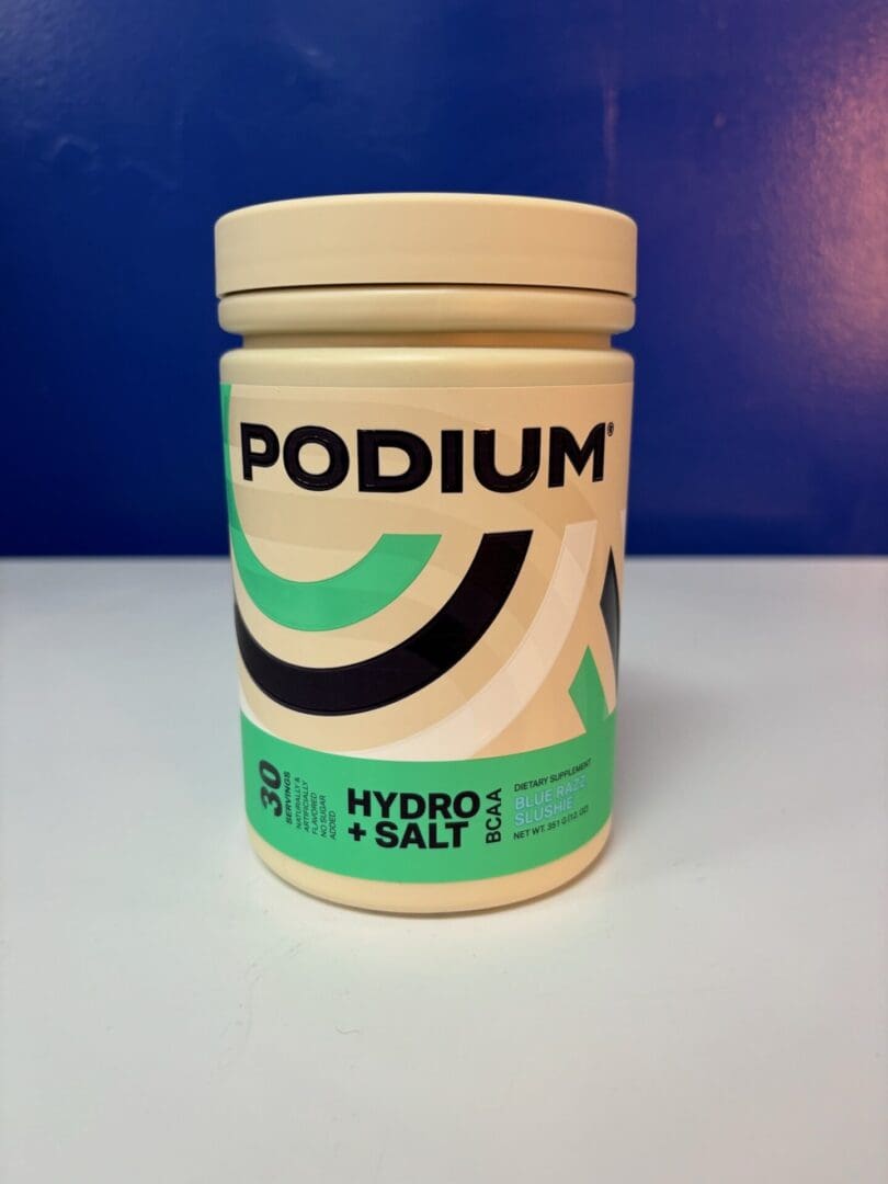 A container of hydrolyzed whey protein on top of a table.