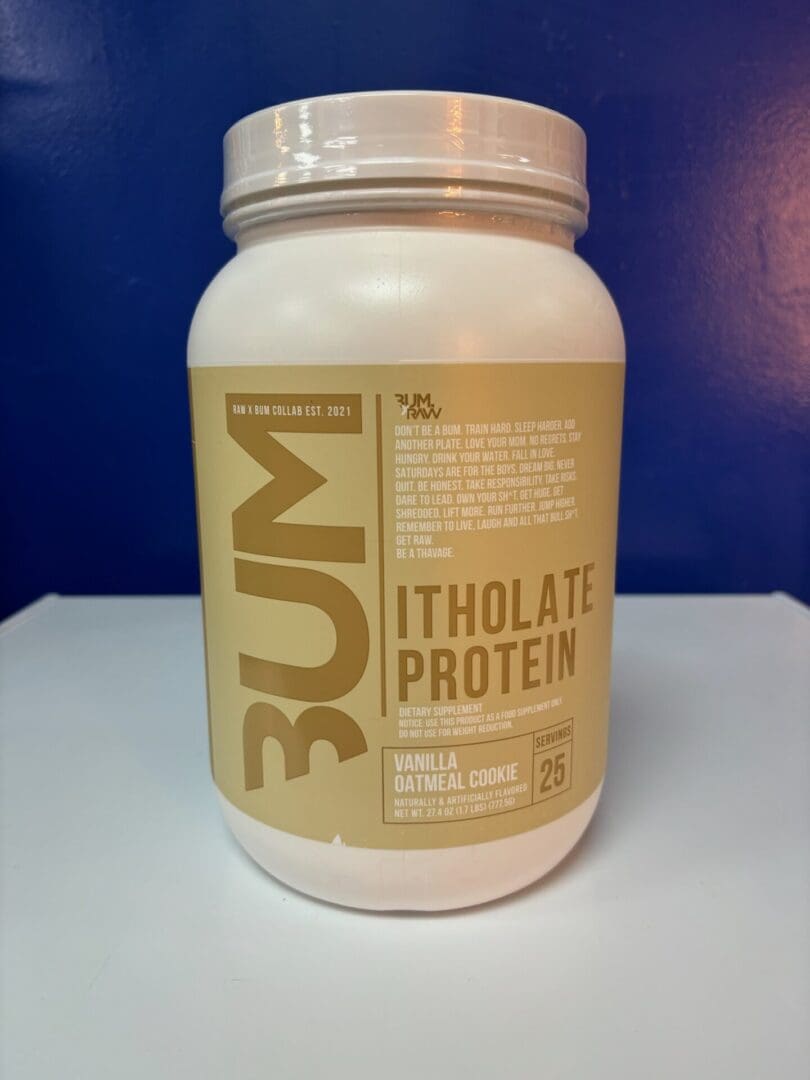 A white container of protein on top of a table.