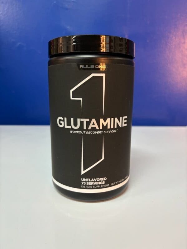 A black container of glutamine on a table.