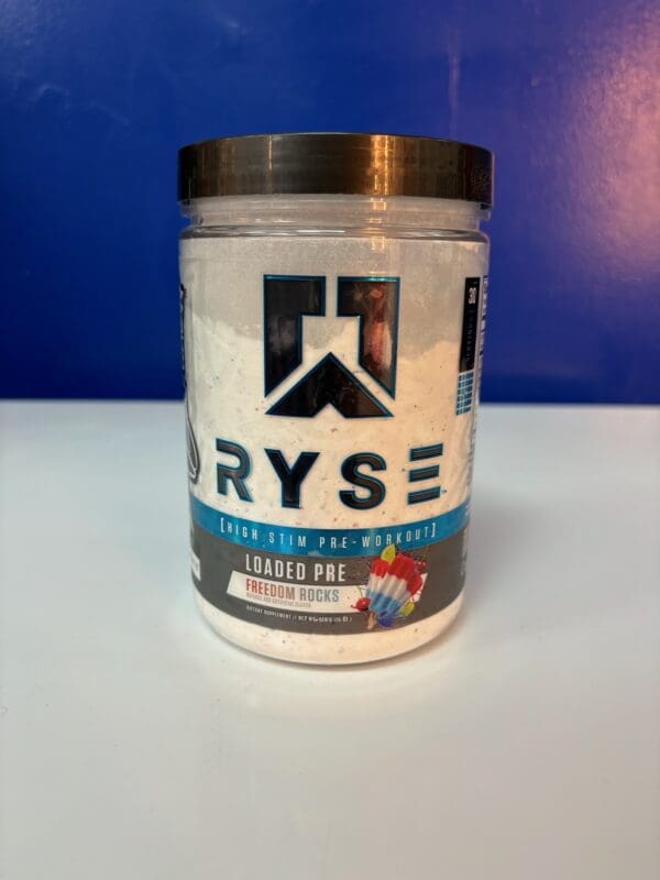 A jar of ryse protein on top of a table.